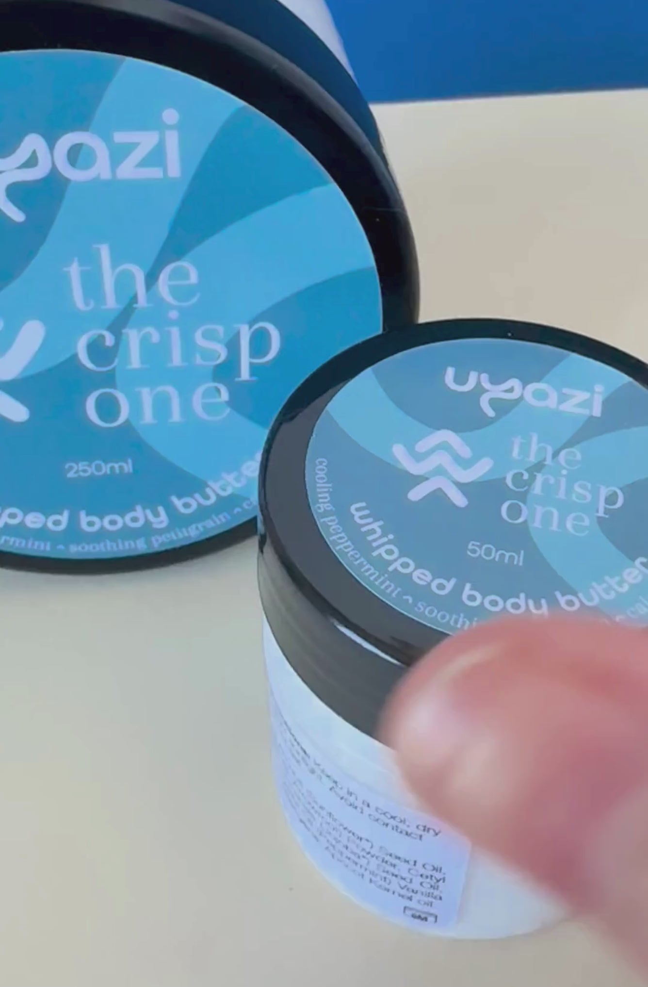 Video capturing the opening of a whipped body butter 50ml jar