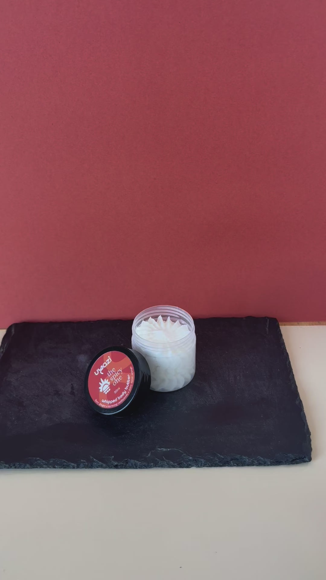 Video close up of an opened 50ml jar of The Spicy One whipped body butter