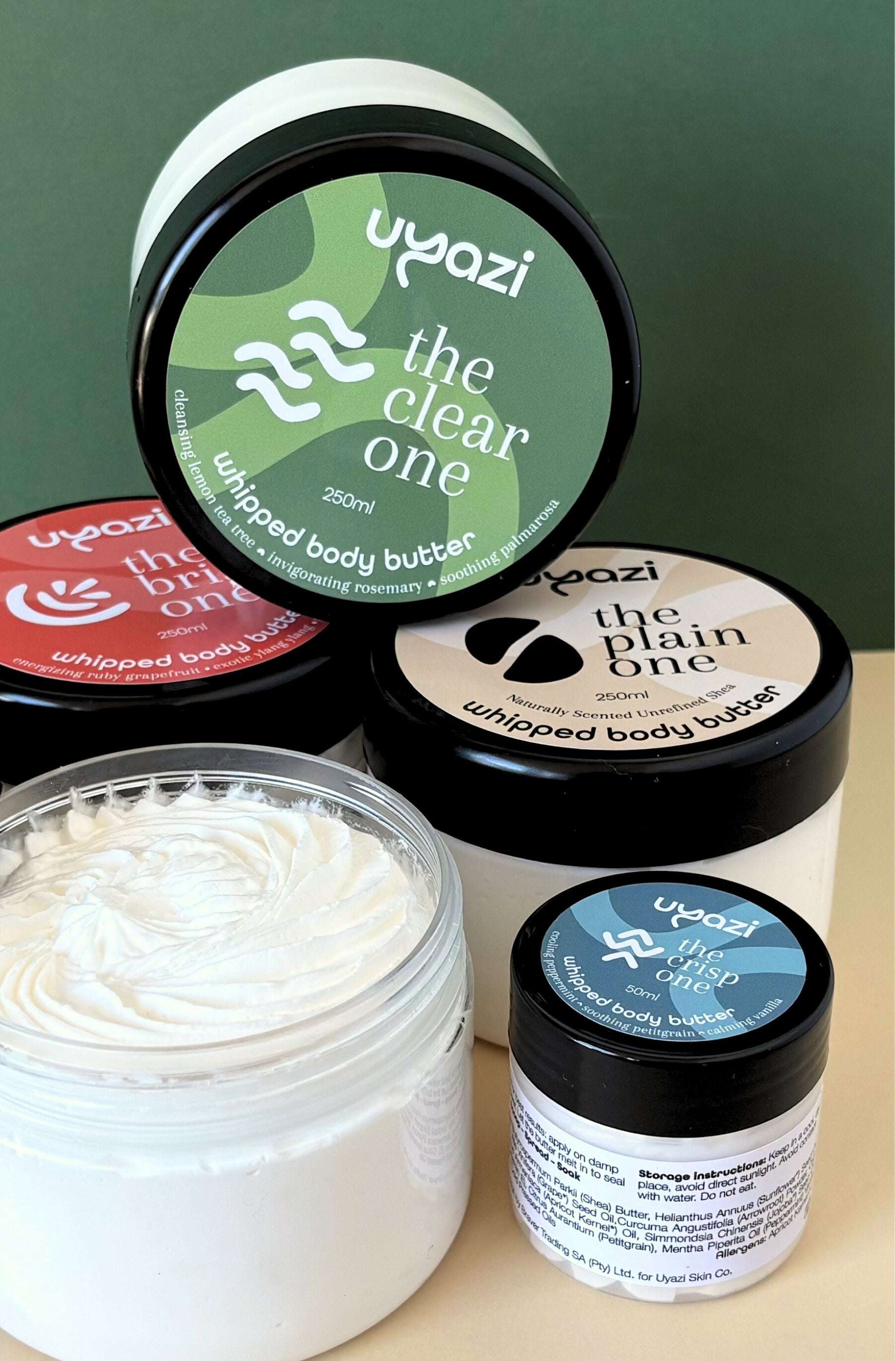 Collection of Vyazi whipped body butter jars with visible branding on a neutral background