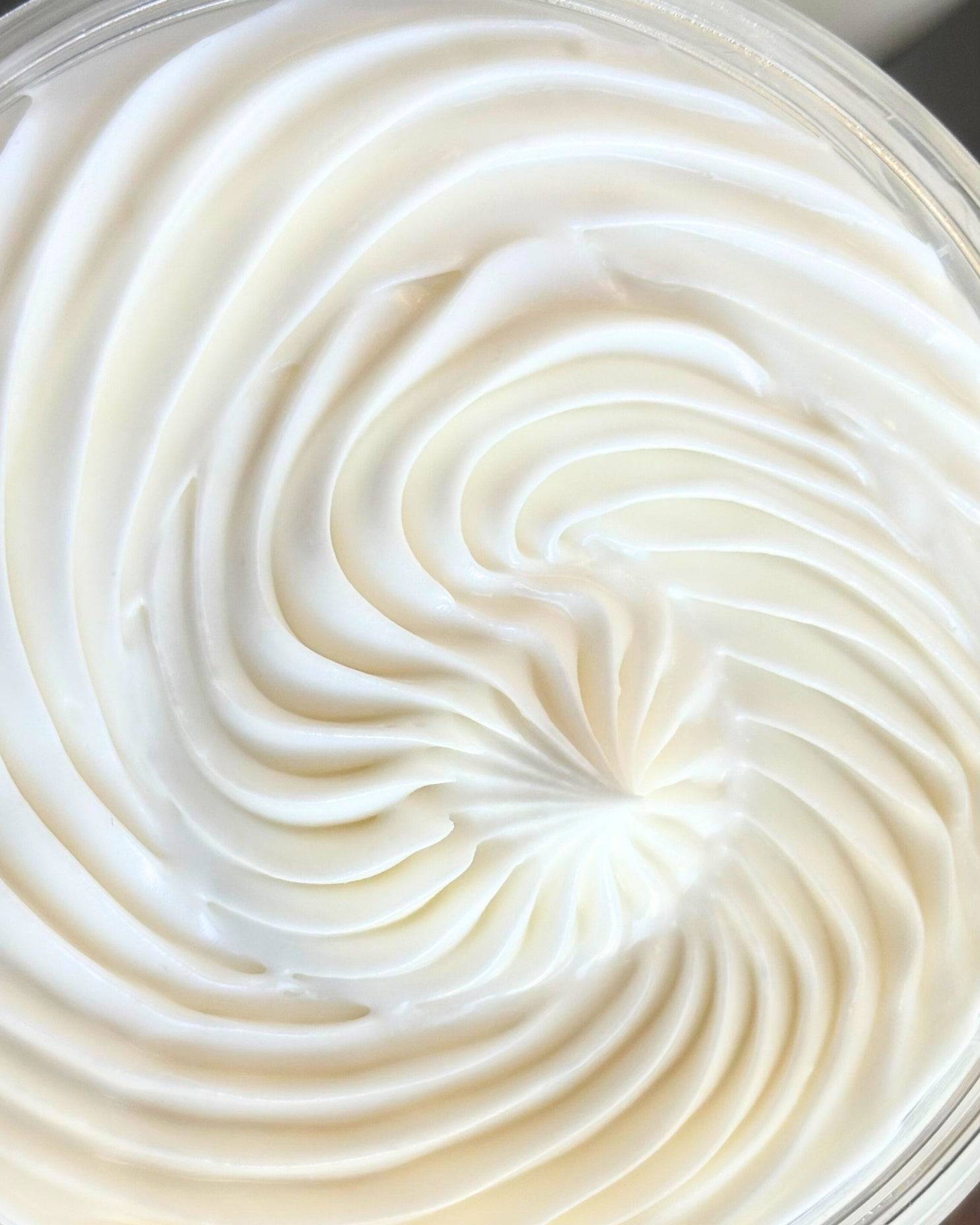 Close-up of whipped body butter with a swirling pattern