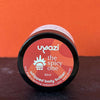 Jar of Uyazi spicy whipped body butter with a red label on an orange background