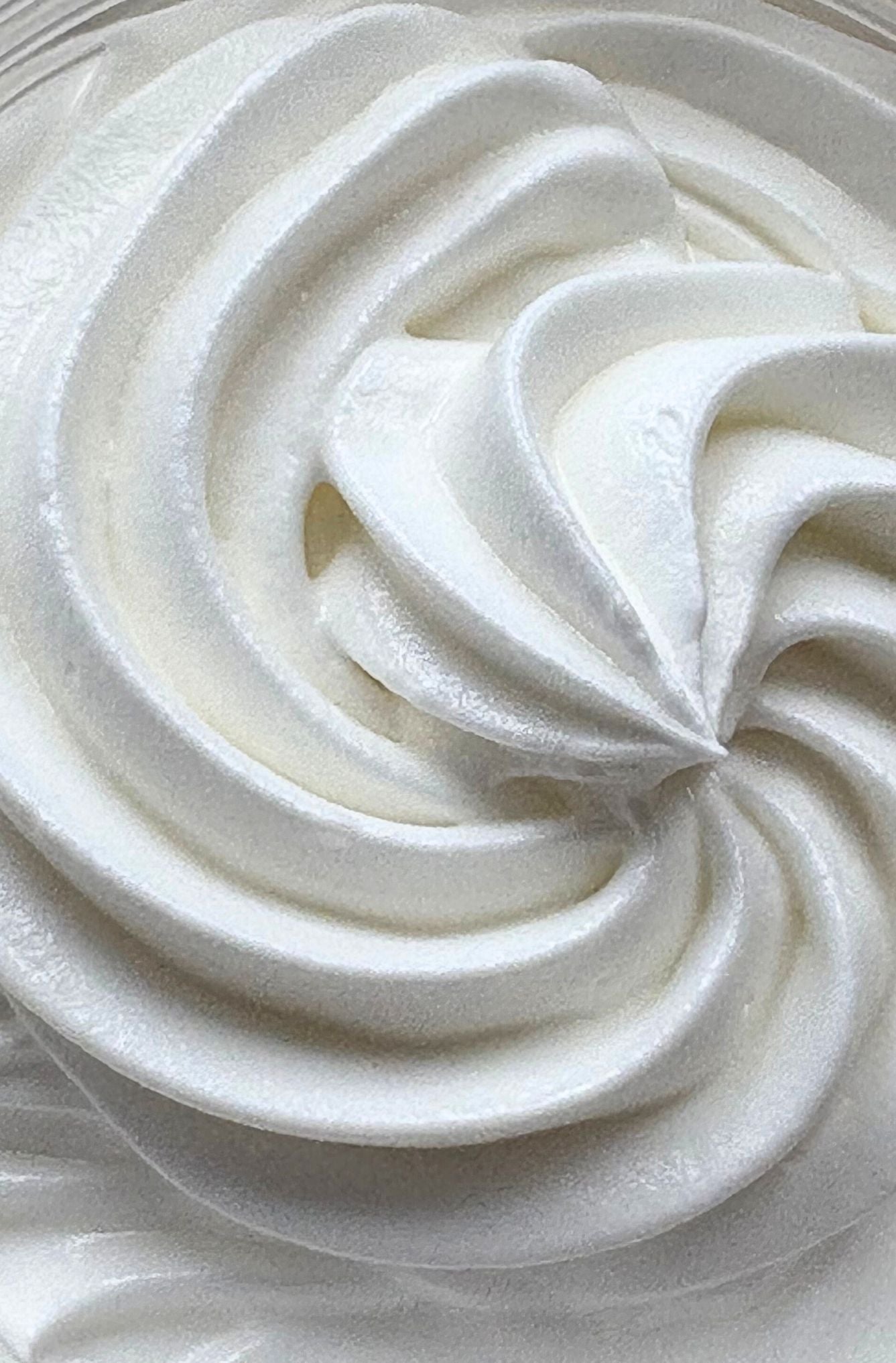 Close-up of a swirl of white whipped cream